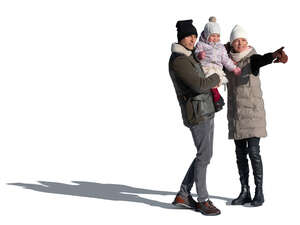 cut out family with a baby standing and pointing in winter