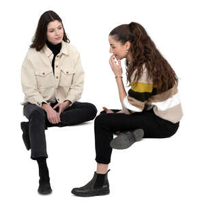 two cut out women sitting and talking