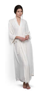 cut out woman in a long bathrobe leaning against the wall