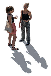 two cut out backlit young women standing seen from above