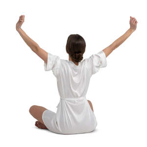 cut out woman in a bathrobe sitting and stretching her arms