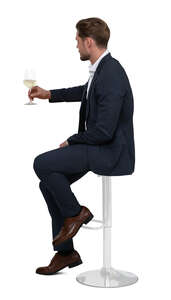 cut out man sitting at a bar and drinking wine