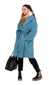 cut out woman in a blue overcoat standing