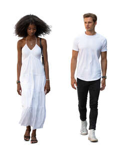 two cut out people in white summer clothing walking