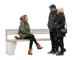 cut out woman sitting and talking to a couple standing next to her