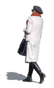 cut out elderly lady in a light grey overcoat walking