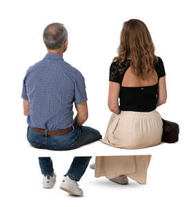 two cut out people sitting seen from back angle