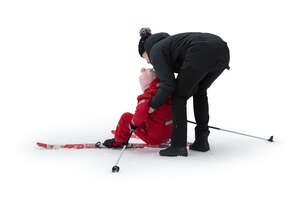 cut out woman helping her daughter up when skiing