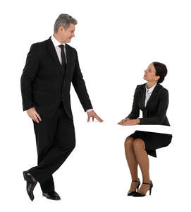 cut out man at office talking to a woman sitting at a work desk 