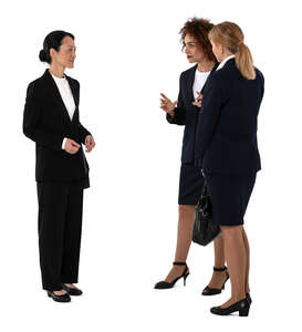 three cut out businesswomen standing and talking