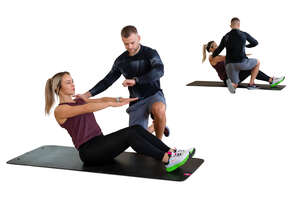 cut out woman exercising in a gym with her personal trainer