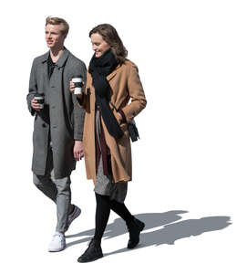 cut out man and woman walking on a sunny autumn day and drinking coffee 