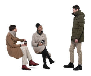 cut out man standing and talking to two women sitting on a bench