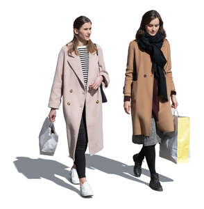 two cut out women wearing overcoats coming from shopping