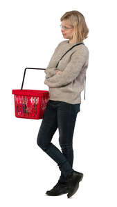 cut out woman with a shopping basket standing in the store