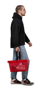 cut out young man with a shopping basket walking