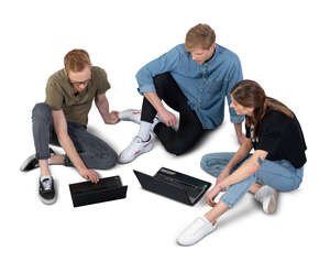 cut out group of university students sitting and studying together