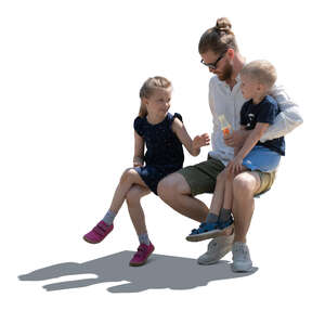 cut out backlit father with two kids sitting