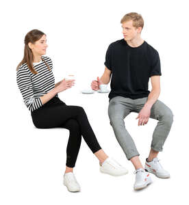 cut out man and woman sitting in a coffee shop