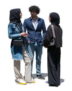 two cut out muslim women and a man standing and talking