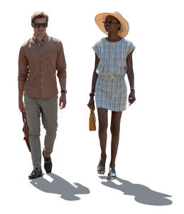 two cut out people walking on a summer day