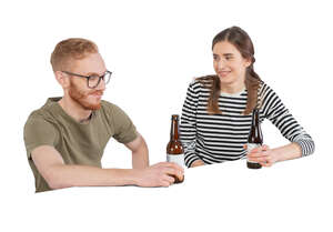 cut out man and woman sitting at a bar and drinking beer