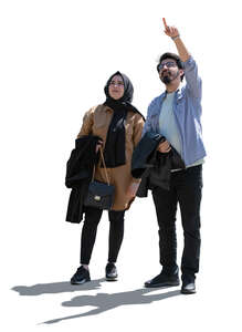 cut out backlit middle eastern man and woman standing and pointing up