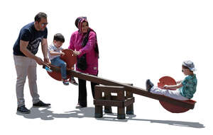 cut out backlit middle east family playing on the playground