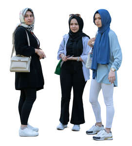 three cut out young muslim girls standing