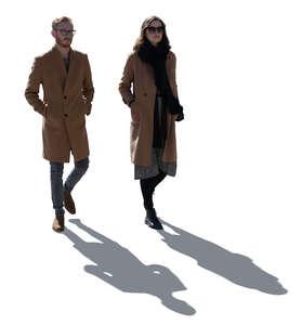 cut out backlit man and woman walking