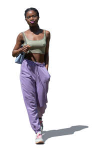 cut out young black woman walking on a summer day