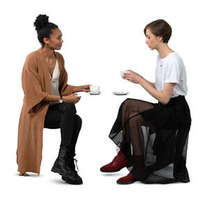 two cut out women sitting in a cafe