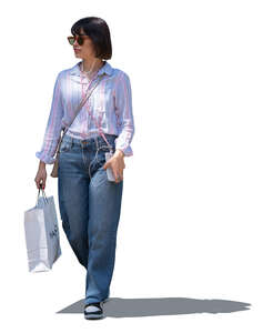 cut out woman with a shopping bag walking in partial shade