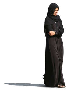 muslim woman in a black abaya walking