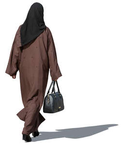 muslim woman in a brown abaya walking