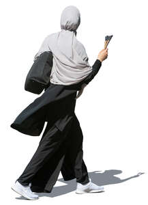 muslim woman walking hastily