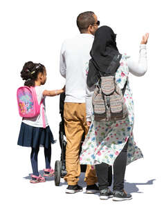 muslim family of three standing