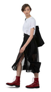 cut out woman in a black skirt walking
