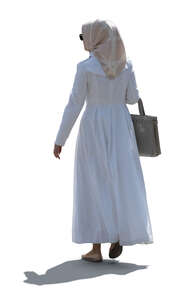 cut out backlit muslim woman walking