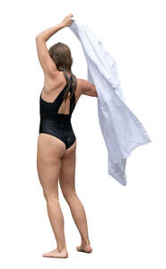 cut out woman coming from swimming and drying herself with a towel