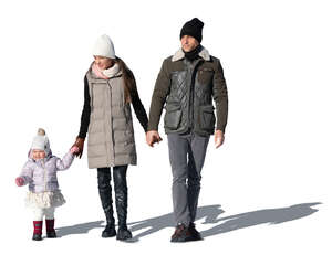 cut out family with a baby girl walking on a sunny winter day