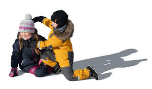 two cut out kids in winter playing outside