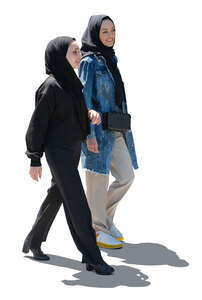 two cut out backlit middle east women walking and talking