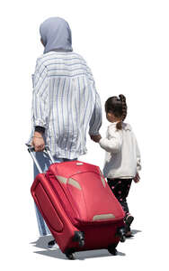 mother and daughter with suitcase walking