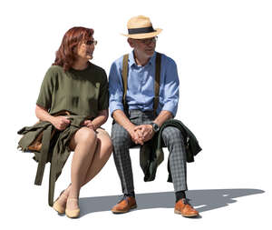cut out older man and woman sitting outside