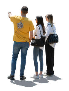 cut out backlit group of three people standing and looking at smth