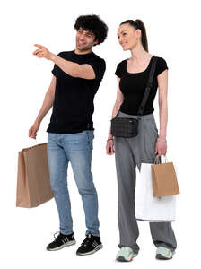 cut out man and woman with shopping bags standing and pointing