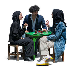 cut out group of three middle east people sitting in a cafe and drinking tea