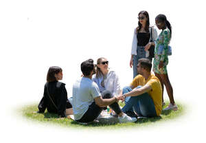 cut out group of people sitting on the grass and talking to some friends standing by