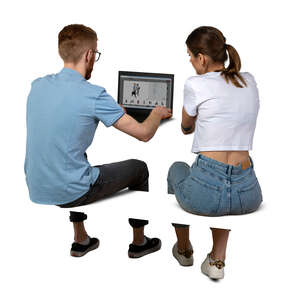 two cut out people sitting at a desk with computer and working